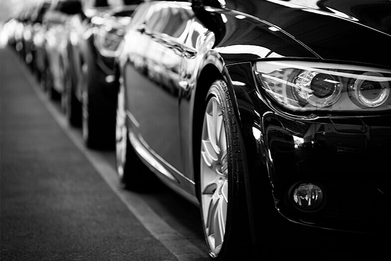 close up of a line of black BMW cars